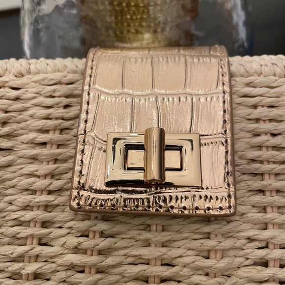 Ann Taylor straw woven clutch with gold accents. Fold over toggle closure. - Picture 5 of 12